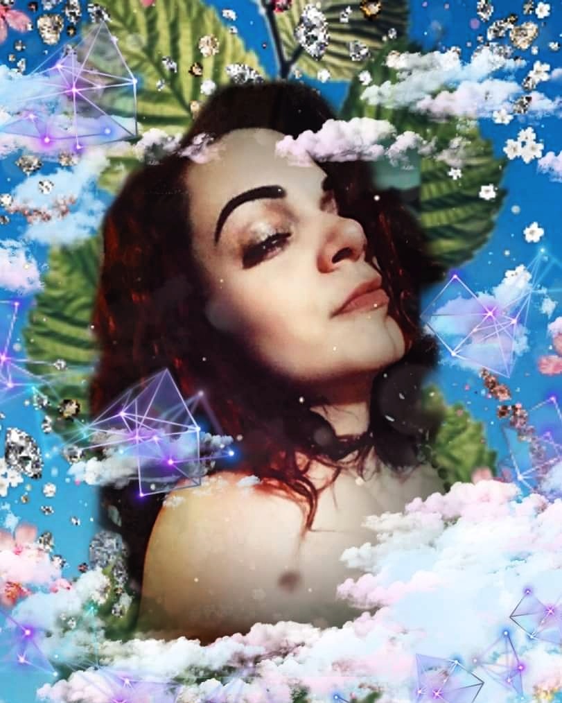 Portrait of a woman with dark hair against a dreamy blue background with clouds, sparkles, and geometric prism shapes.